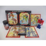 An original bundle of Transformers merchandise to include pictures, a flask etc.