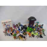 A box of assorted action figures, motorcycles, accessories etc.