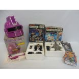 A Starforce Gor helmet (boxed) plus two Grandstand motorised converters (boxed), all unchecked.