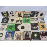 A collection of original Beatles EPs and singles on the Parlaphone and Apple label, 20+ in various