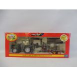 A boxed Britains Valtra Valmet 115 tractor and trailer.