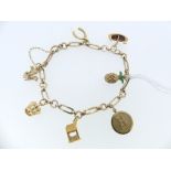 A 9ct yellow gold open link Bracelet, with six 9ct gold charms attached, including ship, crown,