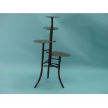 A Secessionist / Aesthetic Movement mahogany four-tier Stand / Whatnot, each tier shaped as a