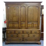 A 17thC style oak triple front Wardrobe/Housekeepers Cupboard, by Bryn Hall Furniture, with dentil