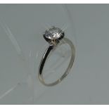 A solitaire diamond Ring, the brilliant cut stone c0.7ct, mounted in 14k white gold, Size H.