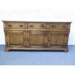 A 17thC style oak Dresser, by Bryn Hall Furniture, with three frieze drawers above three fielded