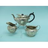 A late Victorian silver three piece Tea Set, by Edward Samuel Jones, hallmarked Birmingham, 1897, of