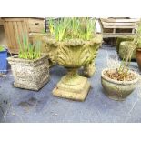 Four reconstituted stone Garden Pots, including a classical shaped urn embossed in high relief