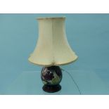 A Moorcroft pottery Anemone pattern Table Lamp, of baluster form, with wood base and shade,