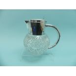 A stylish silver plate mounted cut glass Lemonade Jug, the hobnail cut circular glass body with