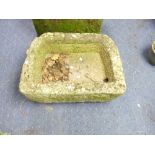 A 'D' shaped rough-hewn weathered Granite Trough, with drainage hole, approx. 28¾in wide x 20¼in