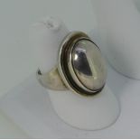 A Georg Jensen sterling silver Ring, pattern no 46, the front set as a silver cabochon, the