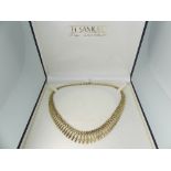 A 9ct yellow gold graduated fringe Necklace, 16in (41cm) long, approx total weight 18g.