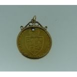 A George III gold 'Spade' Guinea, dated 1787, in 9ct gold pendant mount, coin drilled with a hole