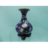 A Chinese cloisonne blue gound Vase, decorated in coloured enamels with flowering Prunus, on