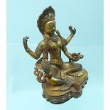 An antique Tibetan gilt bronze figure of seated Chenrezig Bodhisattva, with bead decoration, the