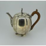 A pair of Elizabeth II silver Teapots, by Nayler Brothers, hallmarked London, 1959, in the form of