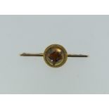 Hunting Interest; A 9ct yellow gold Bar Brooch, the circular centre with a ropework border and