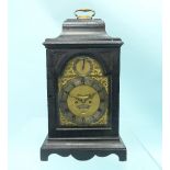 A Georgian ebonised calendar striking Bracket Clock, the bell top case surmounted by a carrying
