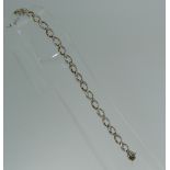 A yellow and white gold link bracelet, with one side of each link in polished yellow gold, the other