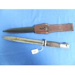 A German Nazi W.W.2 period K98 bayonet and scabbard, with leather frog, the 9?in (25cm) blade with