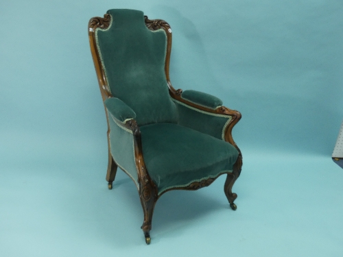An early Victorian rosewood gentleman's Armchair, with buttoned back, padded arms and seat, on