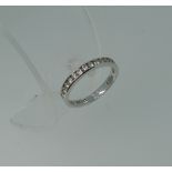A diamond set half hoop Eternity Ring, the front with twelve channel set diamonds, c.0.33cts