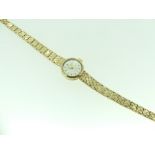 A Rolex Precision 9ct gold lady's bracelet Wristwatch, the silvered dial with baton markers, on