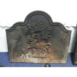 An antique-style cast iron Fireback, with shaped top and embossed with horse and tree decoration,