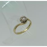 A 9ct yellow gold single stone diamond Ring, set on a twisted shank, Size P.
