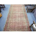 Tribal Rugs; an antique Saraband rug, the faded black ground woven allover with rows of red boteh (