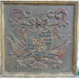 A antique carved and painted Coat-of-Arms, the central quartered shield above military trophies