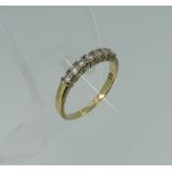 A seven stone diamond Ring, all mounted in 9ct yellow gold, Size O.