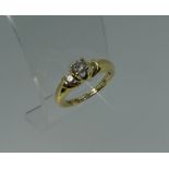 A three stone diamond Ring, mounted in 18ct yellow gold, Size M.