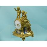 A 19th century French ormolu figural cased Mantel Clock, the case decorated with two seated