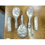 A near matched Edwardian silver backed five piece Dressing Table Set, hallmarked London and Birmingh