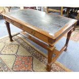 A late Victorian mahogany Map Table, with skived black leather top and two frieze drawers with