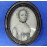 18th century English School, an oval portrait miniature of a young woman, pencil, in oval ebonised