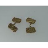 A pair of double-sided 9ct yellow gold Cufflinks, with chain between, foliate and engine turned