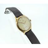 A vintage Omega 18ct gold gentleman's Wristwatch, the circular champagne dial with raised gilt