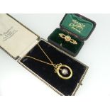 A yellow metal Bar Brooch, set with seed pearls, in fitted presentation case, together with a yellow