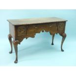 A 17thC style oak Low Boy, by Bryn Hall Furniture, with central frieze drawer flanked by two smaller