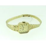 A 9ct gold Rotary lady's Wristwatch, quartz movement, the square gilt dial with black Roman