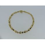 A sapphire and diamond 18ct gold flexible line Bracelet, formed of nine small circular sapphire