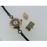 A 9ct rose gold cased lady's wristwatch, on a leather strap, together with a very small 9ct gold