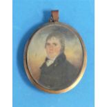 Early 19th century School, a miniature portrait of a young woman, oval, watercolour, in a gilt metal