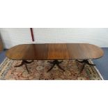 A 19th century mahogany D-end triple pedestal Dining Table, with two additional leaves, the top with