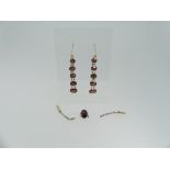 A pair of five stone garnet drop Earrings, on loop hooks, formed from a bracelet, the central