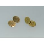 A pair of 18ct yellow gold oval Cufflinks, one side with crest, the other monogrammed, with oval