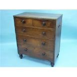 An early Victorian mahogany Chest of Drawers, with reeded edge above two short and three long